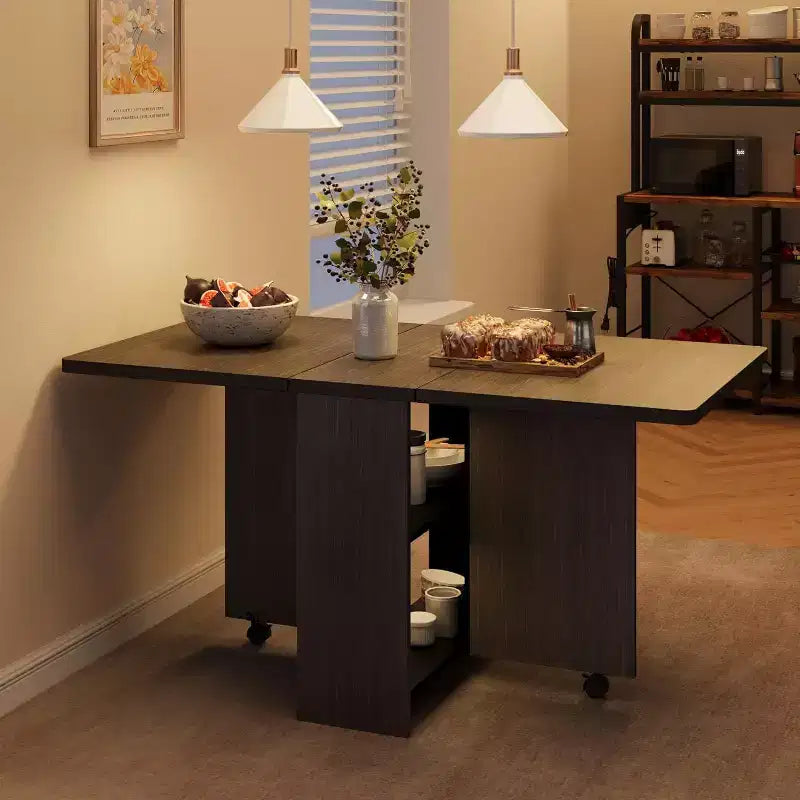 Table de salle à manger pliable et compacte pour 4 personnes avec abattant, 2 étagères de rangement et 6 roulettes pour une mobilité facile
