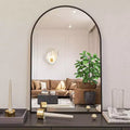 Miroir de salle de bain mural arqué encadré en métal noir 20x30 pouces.