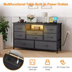 Meuble TV commode avec prise de courant et lumières LED pour téléviseur de 55", centre de divertissement à 8 tiroirs, commode en tissu avec plateau en bois, noir