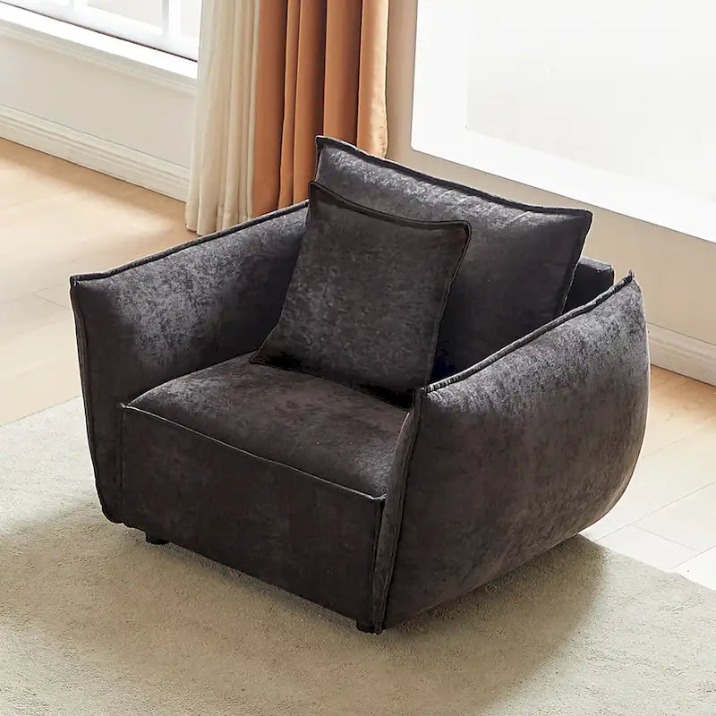 Fauteuil capitonné noir 44 avec oreillers et coussin large