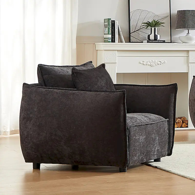Fauteuil capitonné noir 44 avec oreillers et coussin large