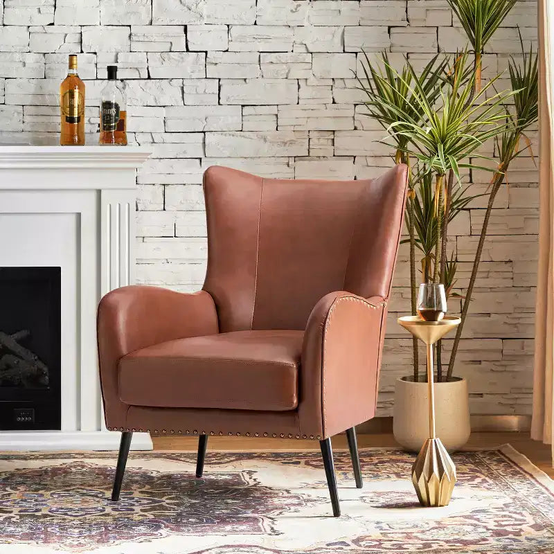 Fauteuil classique Harpocrates à dossier haut et garniture cloutée | ART OF LIVING DESIGNS
