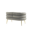 Fauteuil tubulaire long en velours avec pieds dorés