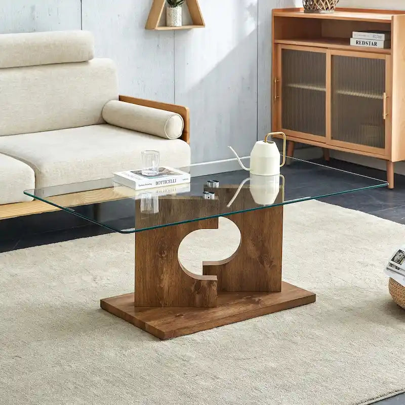 Une table basse rectangulaire moderne avec plateau en verre trempé et pieds en MDF couleur bois. Convient pour le salon.